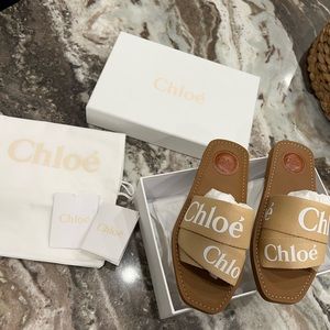 Chloe, woody flat mule in canvas (tan)